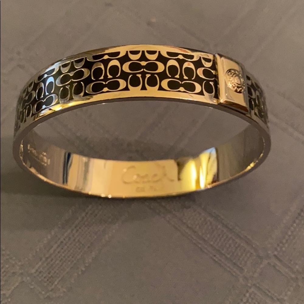 AUTHENTIC COACH SIGNATURE BLACK AND SILVER BANGLE